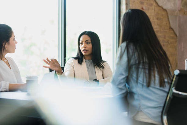 istock At meeting in her office, lawyer discusses case with clients 1333397848