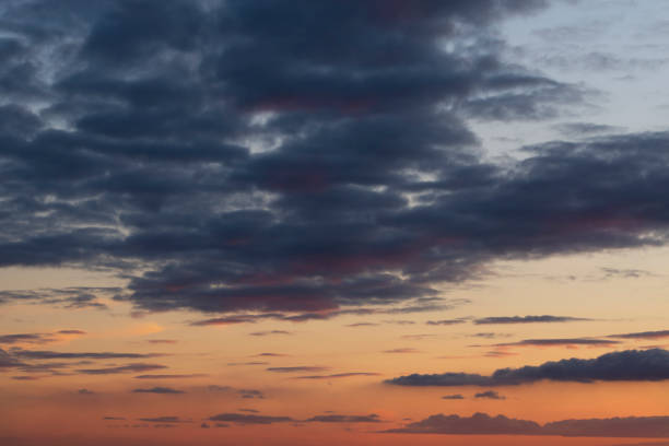 istock Dramatic sunset background.Stormy dark clouds on a red-orange background 1333397875
