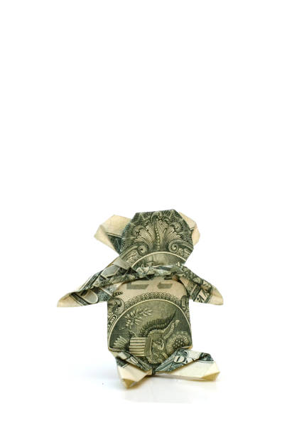 istock A folded dollar bear origami on white 1333398179