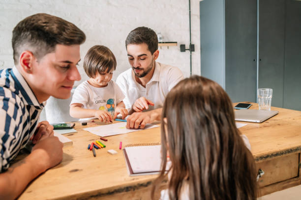 istock Two parents spending time with their kids at home. 1333398831