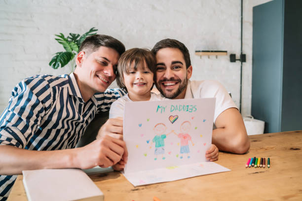 istock Little boy having fun with his parents at home. 1333398843