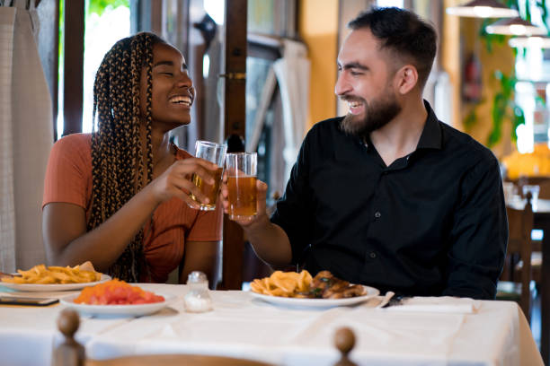 istock Young couple having lunch together at a restaurant. 1333399048