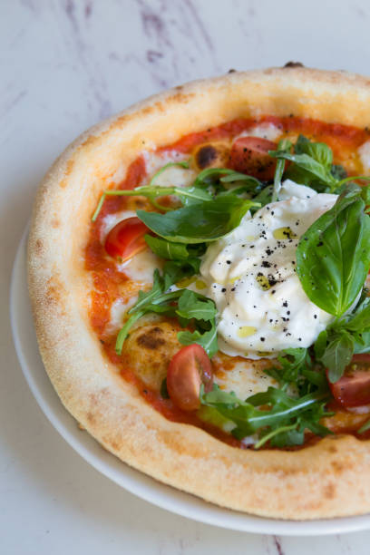 istock Buratta cheese on a neapolitan pizza on a table 1333399995