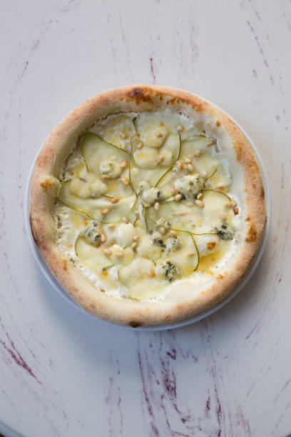 istock Whole neapolitan pizza with pears and cheese 1333399997