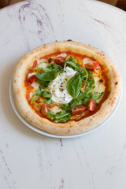 istock Buratta cheese on a neapolitan pizza on a table 1333400035