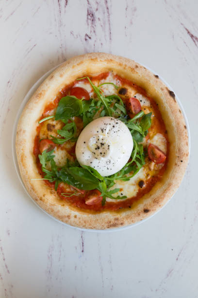 istock Buratta cheese on a neapolitan pizza on a table 1333400204