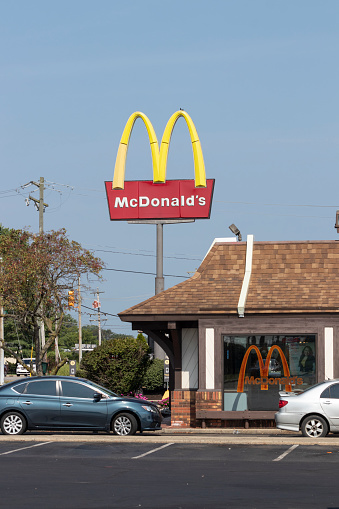 Harrison - Circa August 2021: McDonald's Restaurant. McDonald's will no longer lobby against minimum wage hikes and are offering higher hourly wages, paid time off, backup child care and tuition payments.