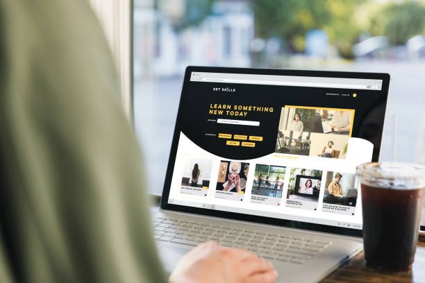 istock Sitting at cafe, young woman surfs net for online classes 1333401864