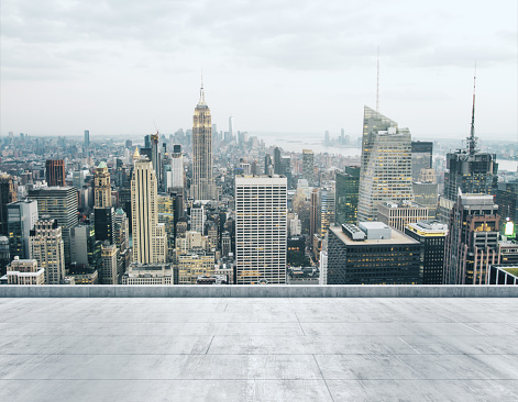 Empty concrete dirty rooftop on the background of a beautiful NY city skyline at daytime, mock up