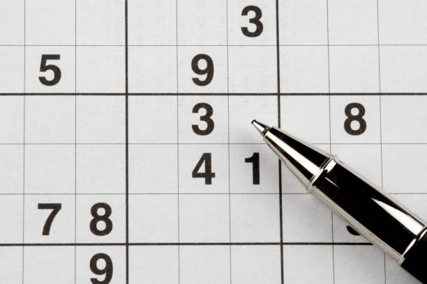 istock Sudoku Puzzle and Roller Ball Pen Closeup View 1333402513
