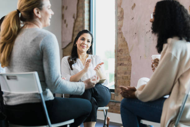istock Multi-ethnic group of women cheerfully interact during meeting 1333402651