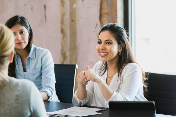 istock CEO smiles as she listens to unrecognizable employee 1333402664
