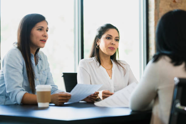 istock Serious female business owners discuss spreadsheets with financial advisor 1333402665