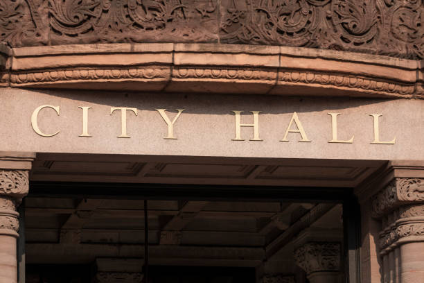 istock City Hall in gold text set against granite columns. 1333402768