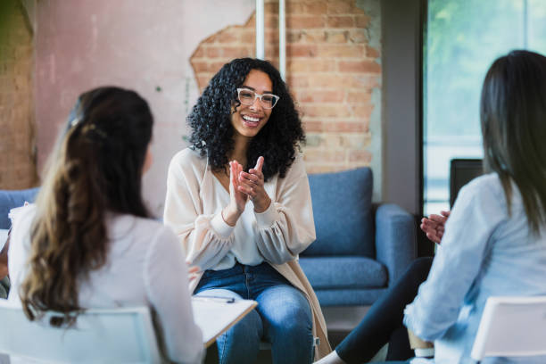 istock Group of women clap during group therapy 1333403153