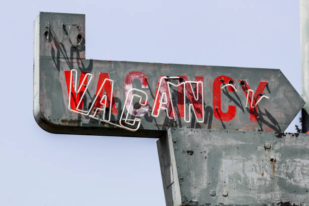 istock Vacancy sign on a deserted motel - worn, broken and forgotten VACANCY sign. 1333403187
