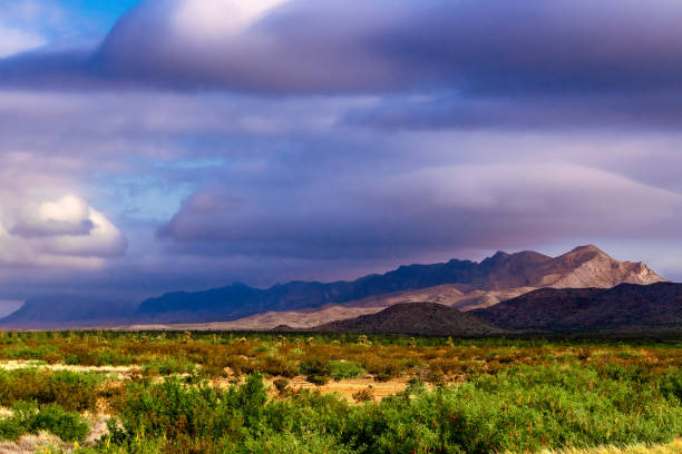 istock clouds wash over the sun kissed mountains 1333406570