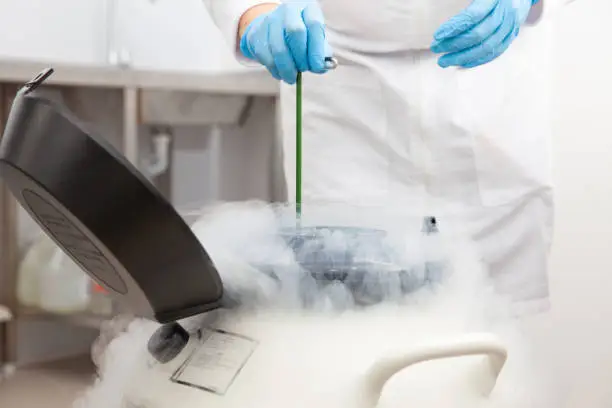 Liquid nitrogen cryogenic tank at life sciences laboratory: Steam of nitrogen created from liquid nitrogen exposed to ambient temperatures