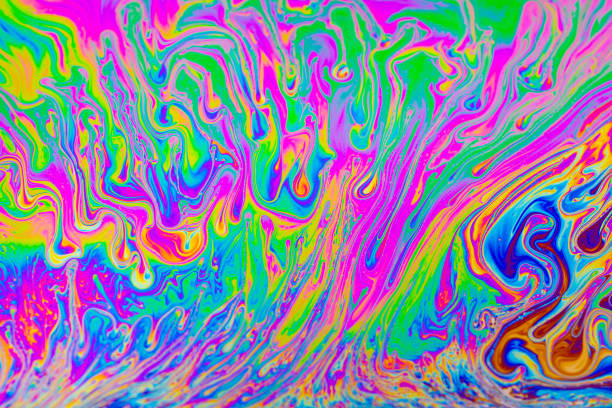 istock Rainbow colors. Psychedelic multi colored patterns background. Photo macro shot of soap bubbles 1333408148
