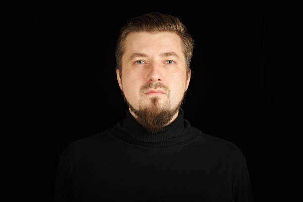 istock Cute bearded young guy in black polo neck sweater. 1333409295