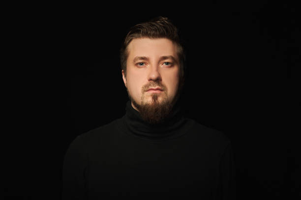 istock Cute bearded young guy in black polo neck sweater. 1333409300