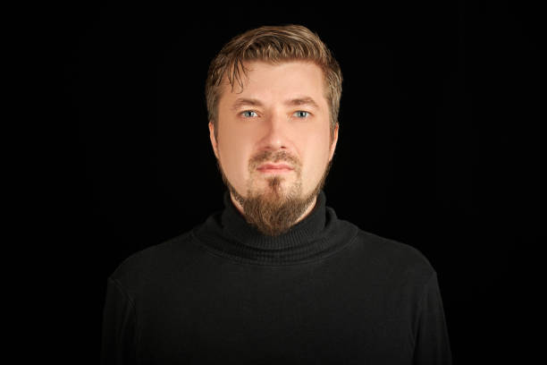 istock Cute bearded young guy in black polo neck sweater. 1333409316