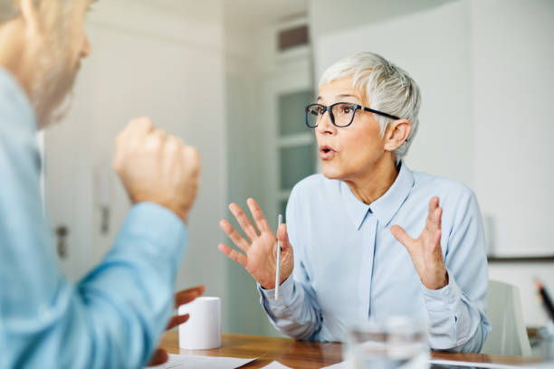 istock business office person discussion document papers teamwork senior meeting 1333412408