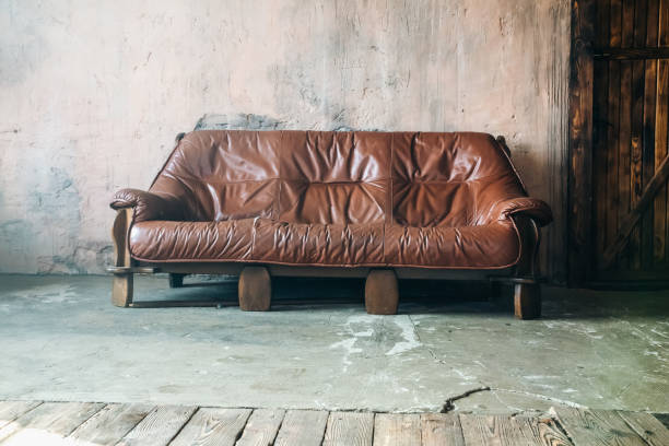 istock Brown leather sofa in loft design apartment. 1333413637