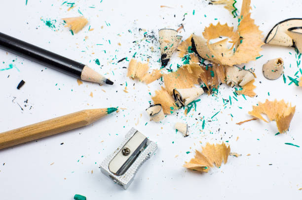 istock Sharpener and a broken pencil. Shavings and a graphite on white background. Close up, Macro photo. Back to school concept. 1333413707