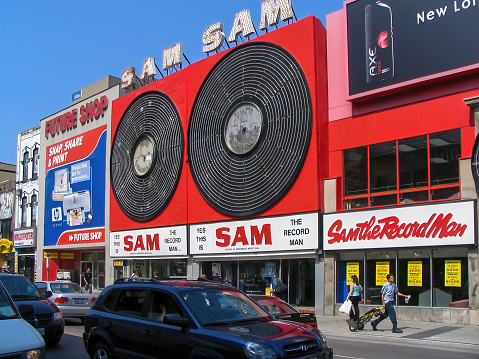 Toronto, Canada - July 15, 2005: The flagship Sam the Record Man store at 347 Yonge with its iconic neon sign was a Toronto landmark from 1961 to 2007. The franchise was founded in 1937 by Sam Sniderman and was at one time Canada’s largest music retailer. Sam is still recognized for his contributions to the Canadian music industry.