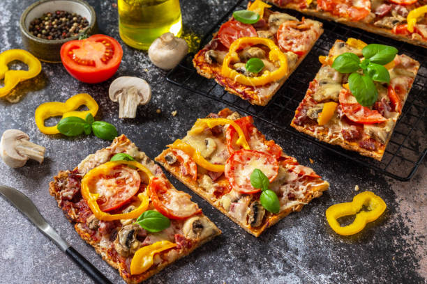 istock Homemade baking Detroit-Style pizza. Large rectangular Pepperoni pizza with mushrooms, salami and cheese on a stone tabletop. 1333418019