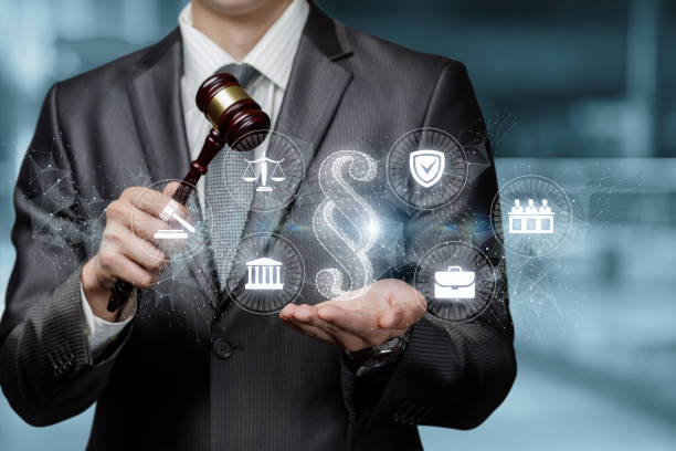 Lawyer shows paragraph hologram with legal icons . Lawyer shows paragraph hologram with legal icons on blurred background. common law stock pictures, royalty-free photos & images