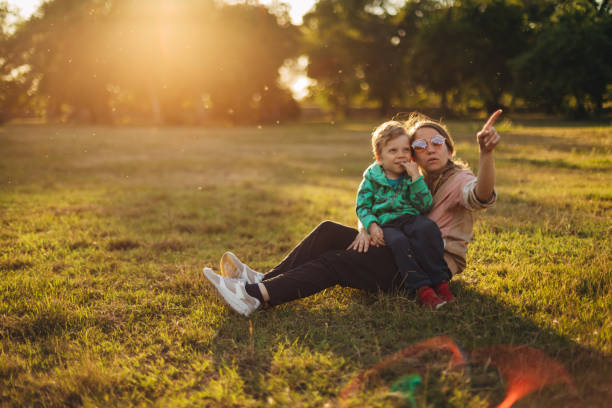 istock Mother explaining to his son, everything he is curious about during their adventurous day in the nature 1333421722