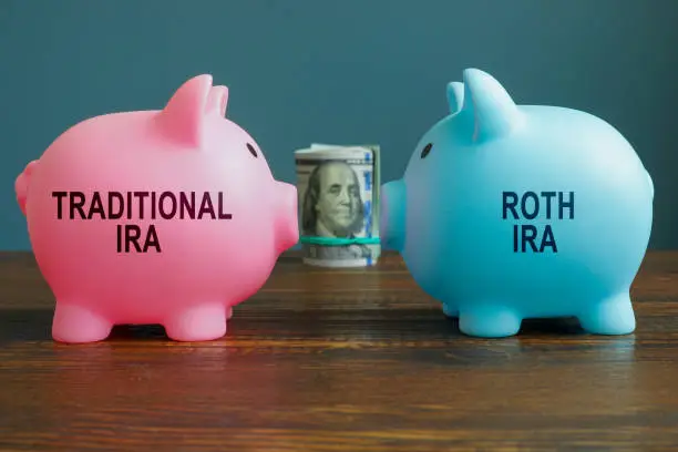 Photo of Options Traditional IRA or Roth IRA retirement plans as piggy banks.