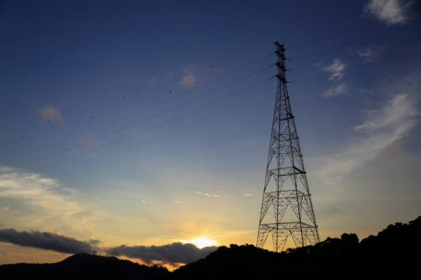 Antenna for power line at sunset with text space