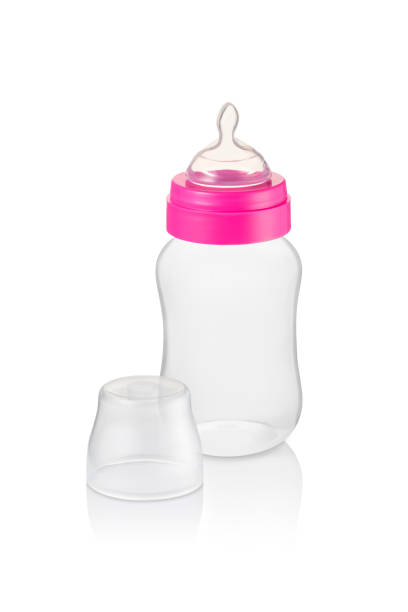 istock Small baby bottle with pink ring and transparent cap aside, isolated 1333423377