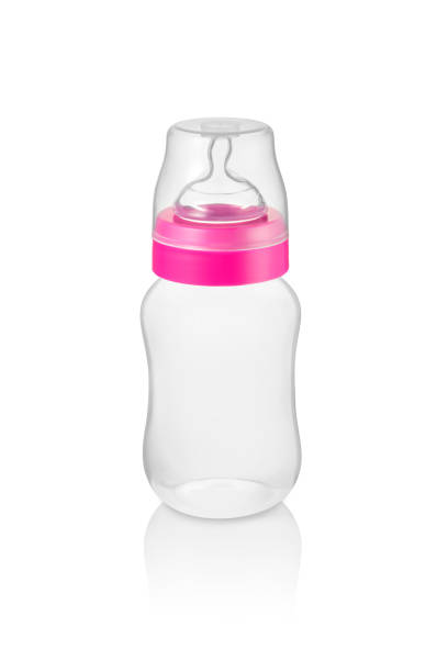 Small baby bottle with pink ring isolated