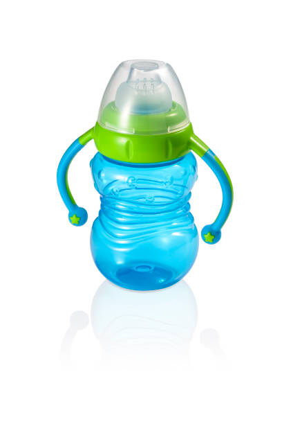 istock Fun blue baby bottle with handles and green ring isolated 1333423437