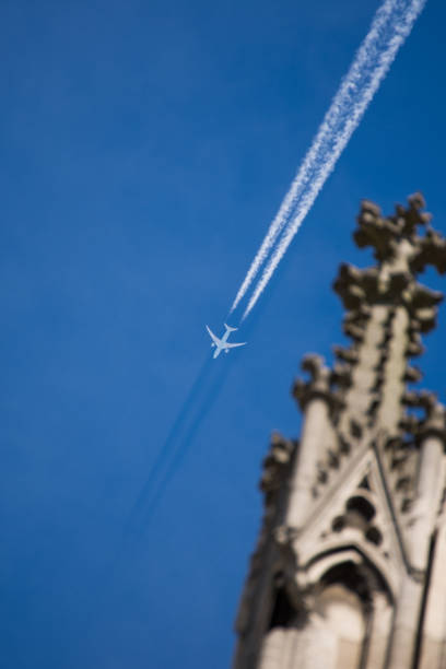 Cologne Cathedral Tower  an airplane vapor trails  in Germany May, 2017