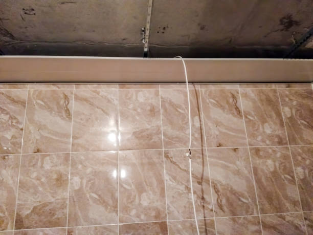 istock Installation of electrical wiring for built-in lamps. 1333428371