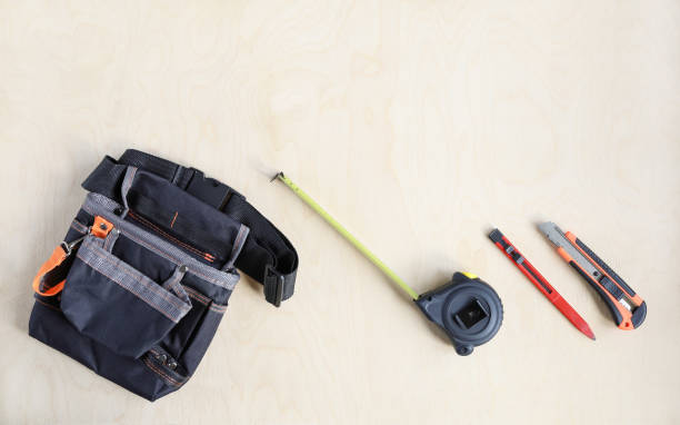 istock Building bag for belt and some working instruments tools on plywood of surface 1333428710