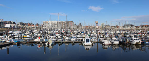 Blankenberge, Belgium, 2 August 2021: View of the busy yacht harbour at Blankenberge on a summers evening. Blankenberge is a very popular beach resort on the Belgian Coast.