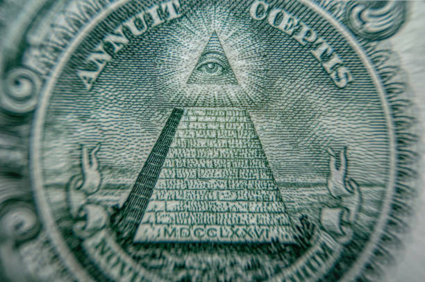 istock Eye and pyramid. Mysterious Masonic signs on American dollar bills 1333432005