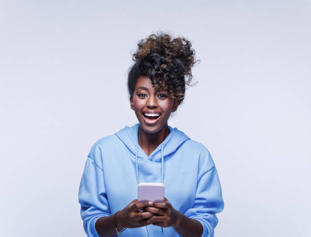 istock Excited female student in blue hoodie 1333432054