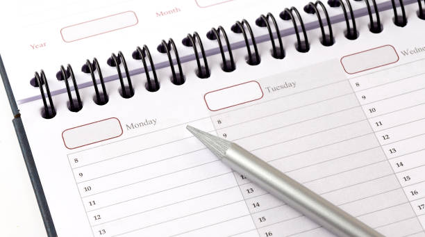 istock close up top view on white calendar with pencil 1333433187