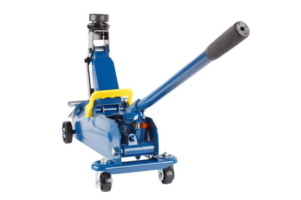 istock blue hydraulic car jack isolated on white background, rised up 1333433493