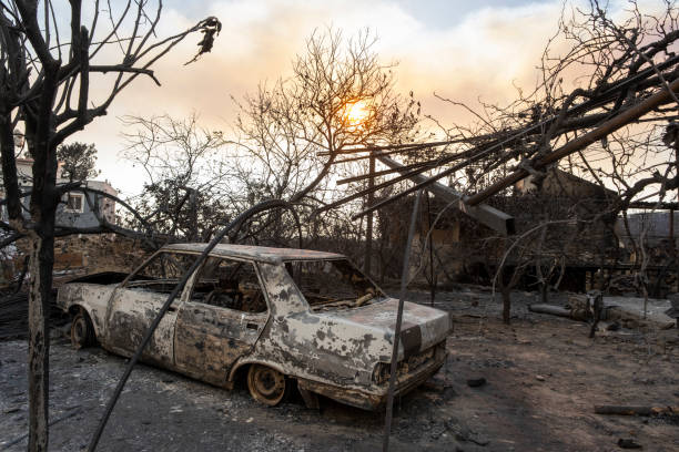 istock Burnt and damaged car 1333435157