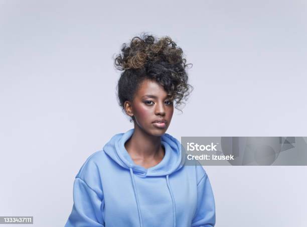 Worried Young Woman In Blue Hoodie Stock Photo - Download Image Now - Displeased, One Woman Only, Women