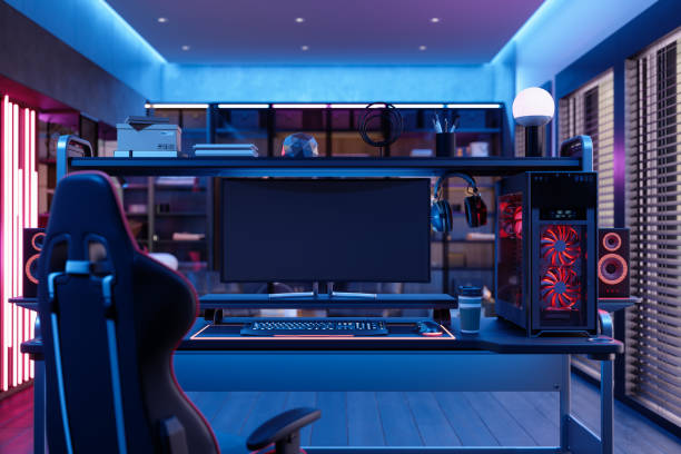 sala da gioco di notte con luce al neon. sedia da gioco, altoparlanti e monitor per computer nella stanza - desktop games foto e immagini stock