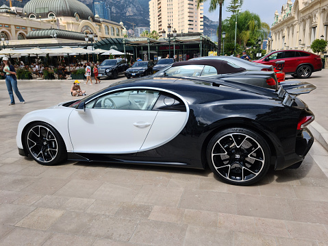 Monte-Carlo, Monaco - July 24, 2021: Beautiful White Bugatti Chiron Luxury Supercar Parked In Front Of The Monte-Carlo Casino In Monaco On The French Riviera, Europe - Side View